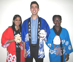 JICC staff wearing happi coats and  holding masks