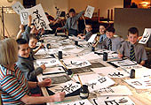 Pupils from Ardingly College show off their calligraphy masterpieces