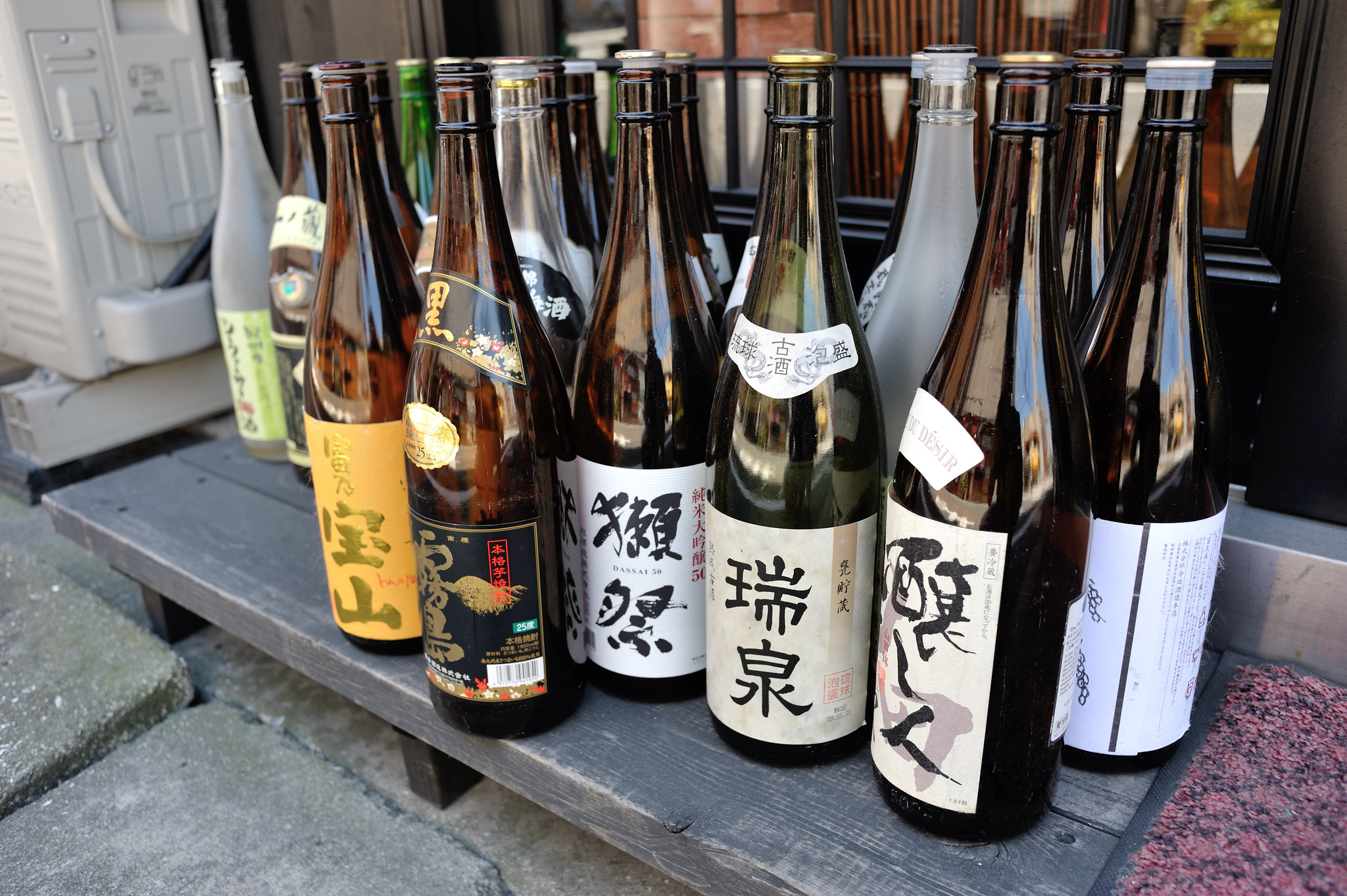 Img:Rows of sake bottles