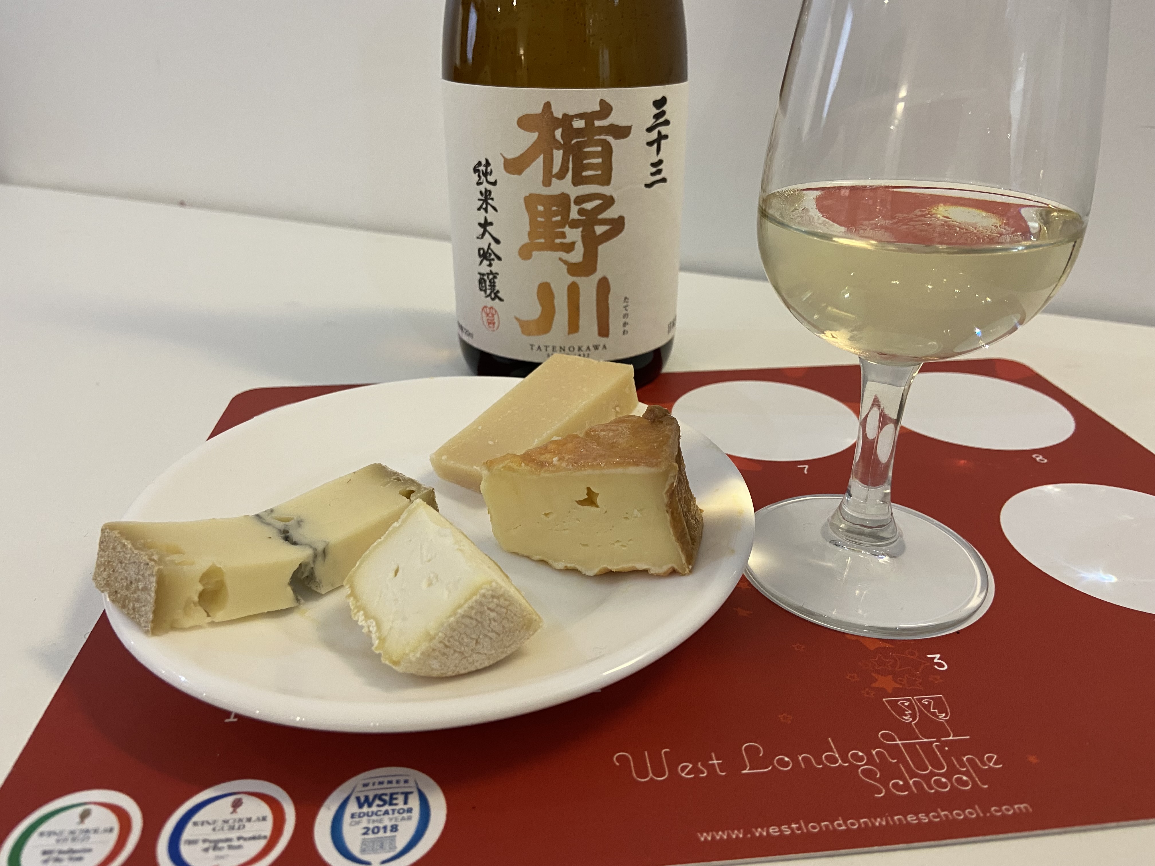 Img:Sake bottles and cheese