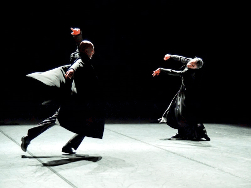 Img:man and woman dancing in black outfit