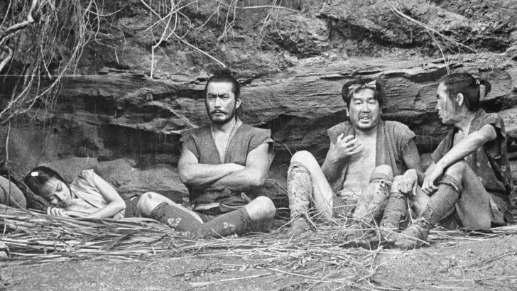Img:Girl Sleeping and three guys sitting in cave