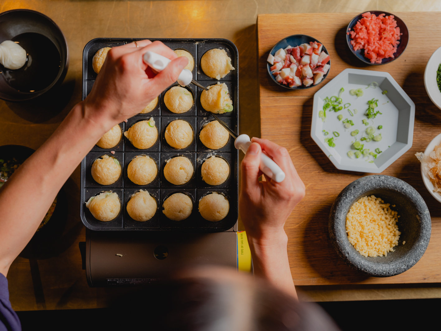 Img:Takoyaki is cooking on iron plate