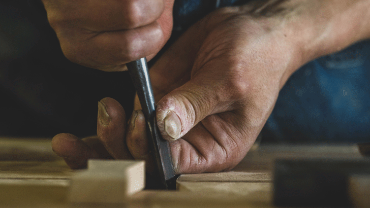Img:Carving wood with both hand