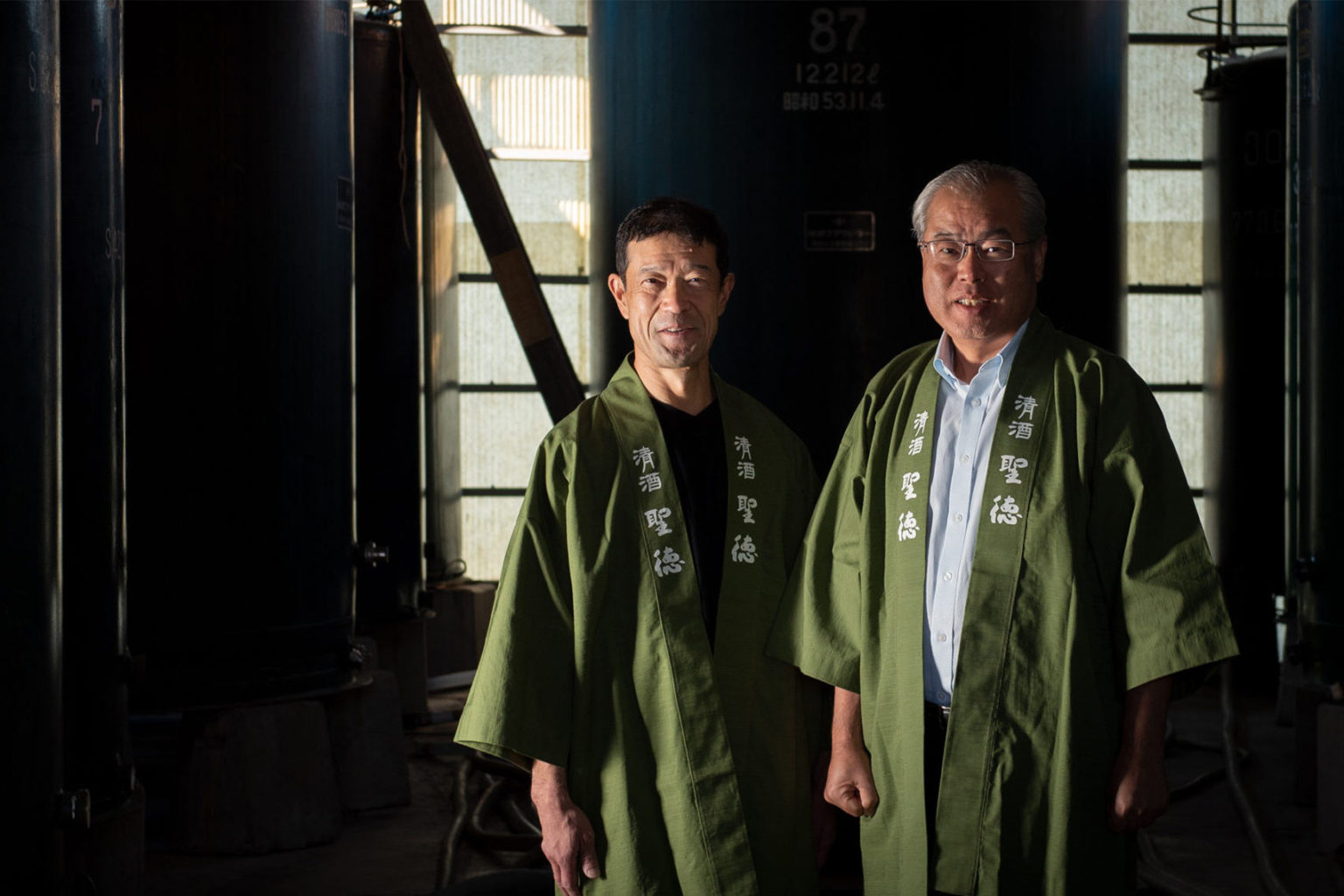 Img:Two man standing at their Brewery