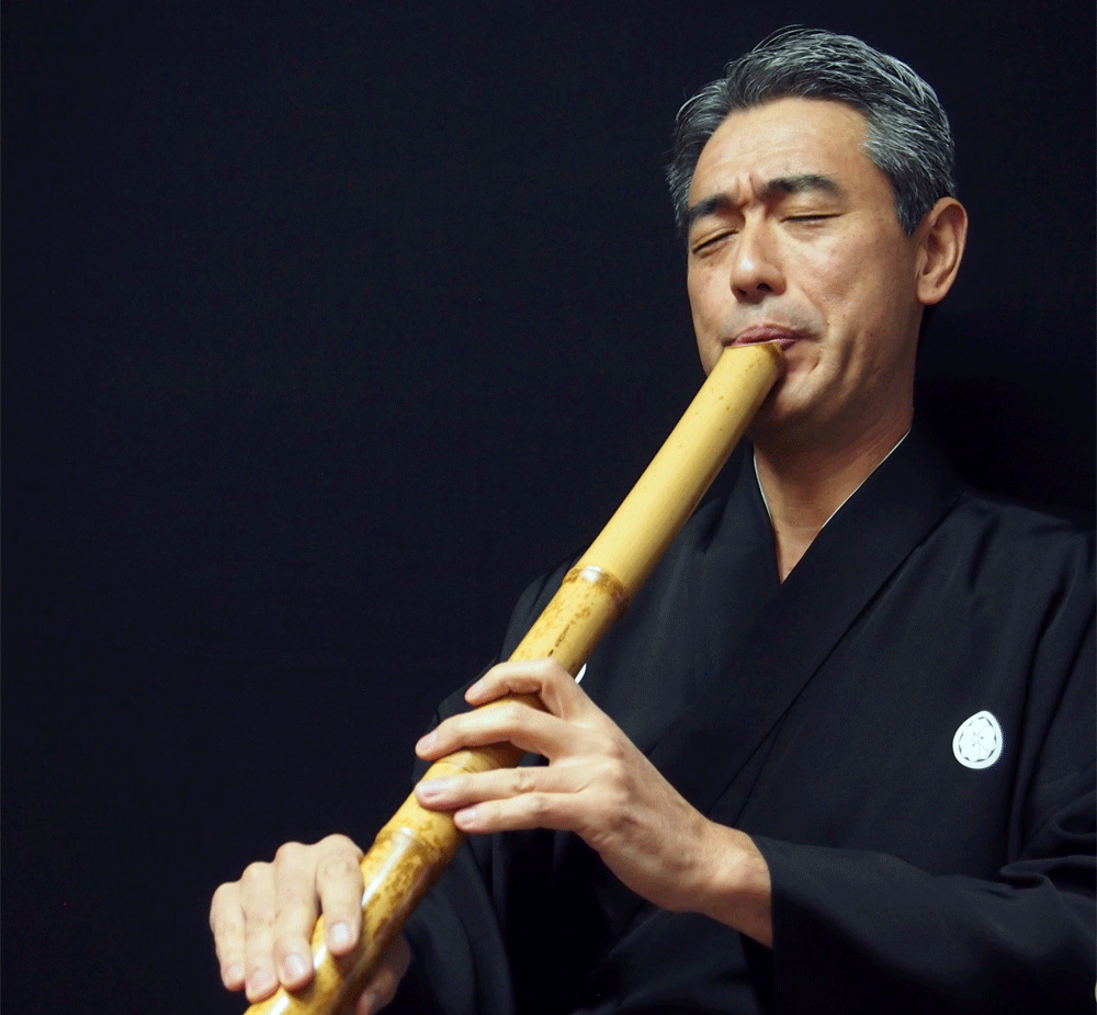 Img:man playing shakuhachi