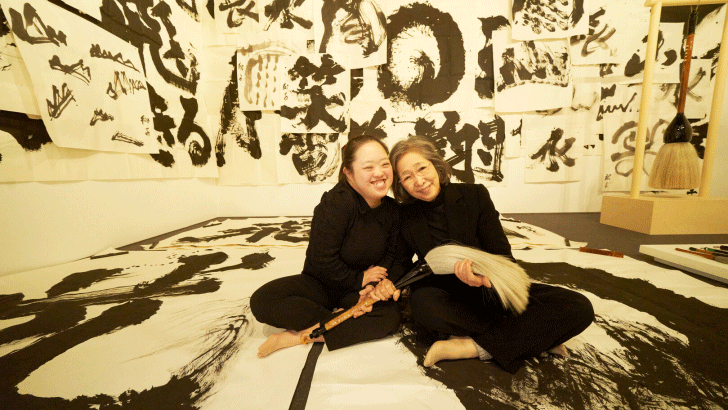 two ladies sitting on the floor with big blush
