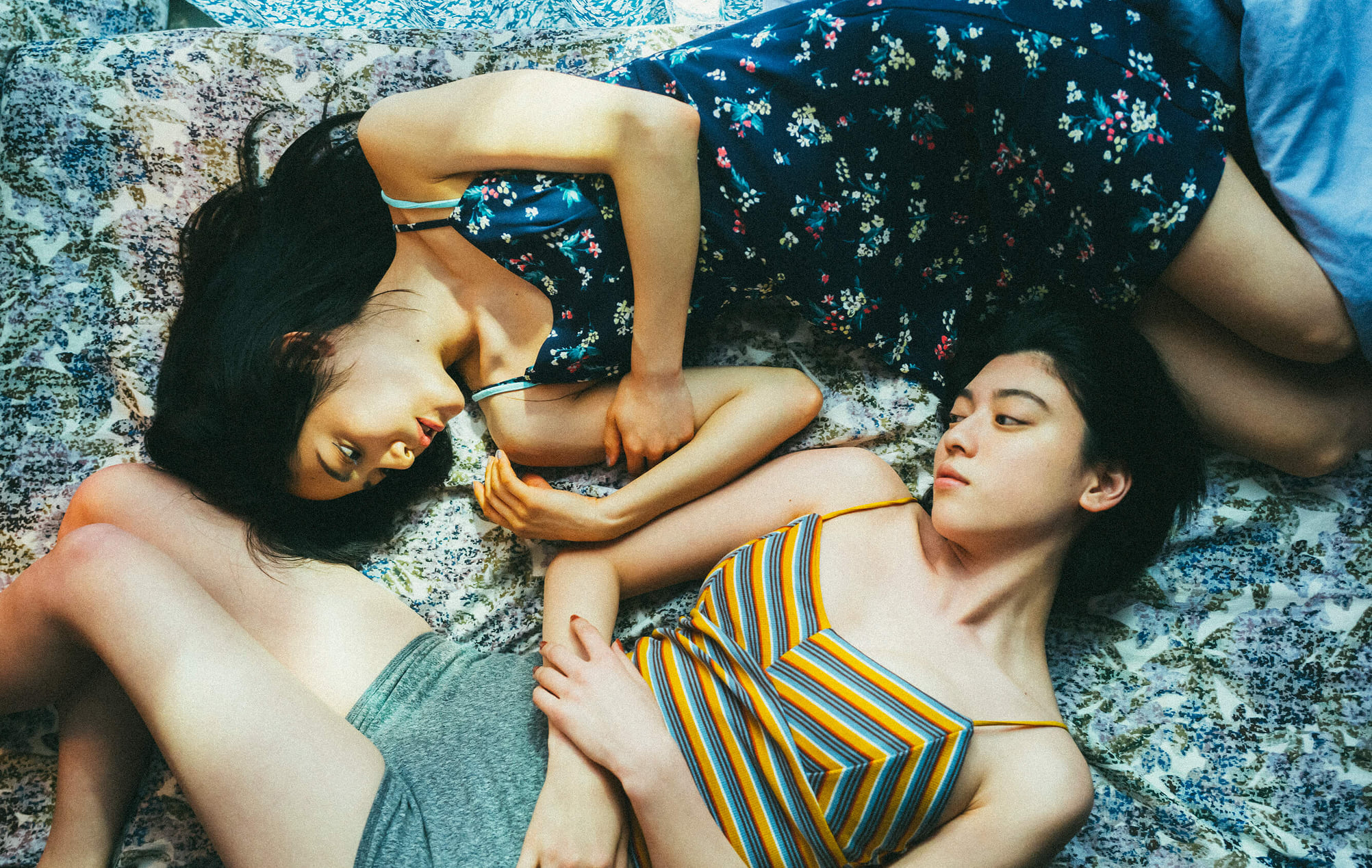 Img: Two women lying on the floor