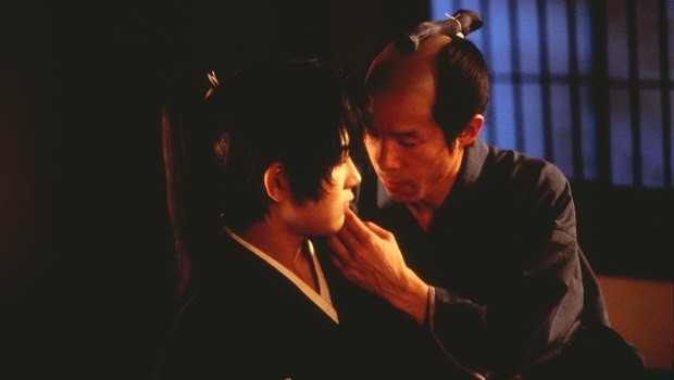 Samurai caressing another's face