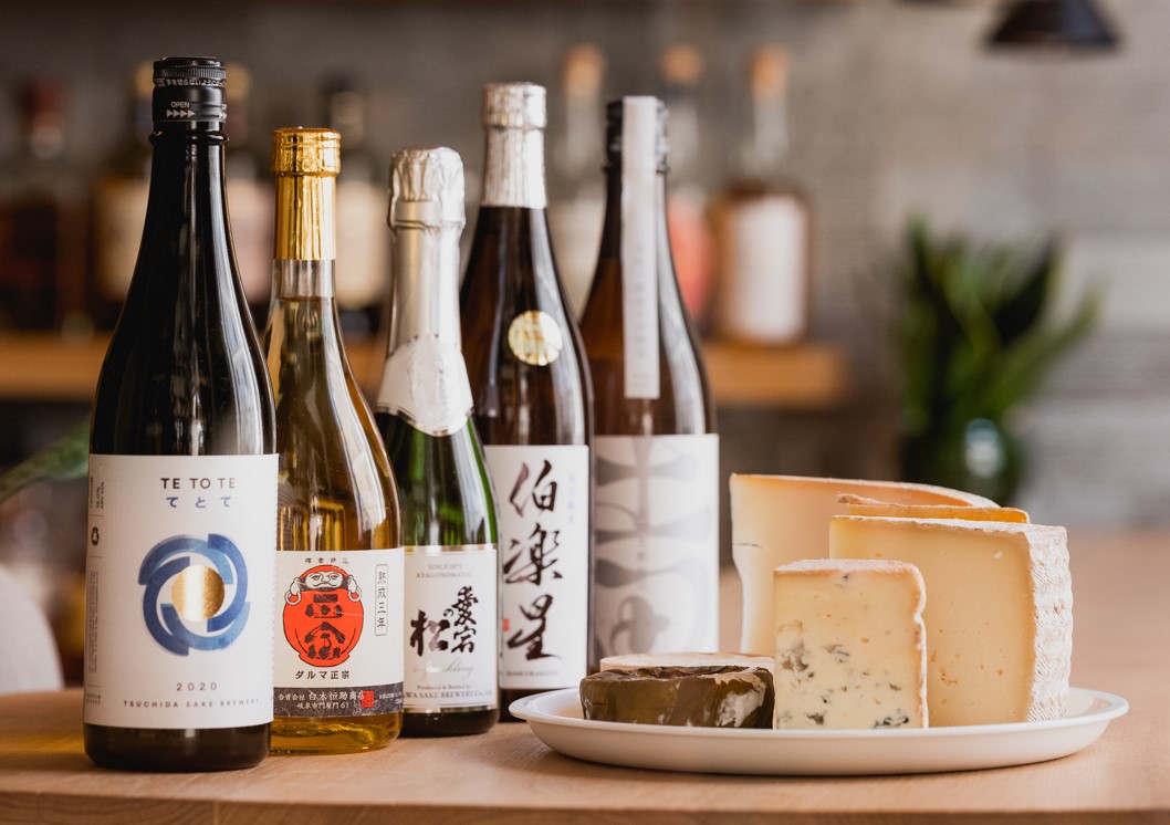 Sake bottles and cheese