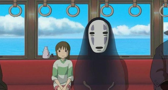 Img: Girl and masked demon on a train in Spirited Away