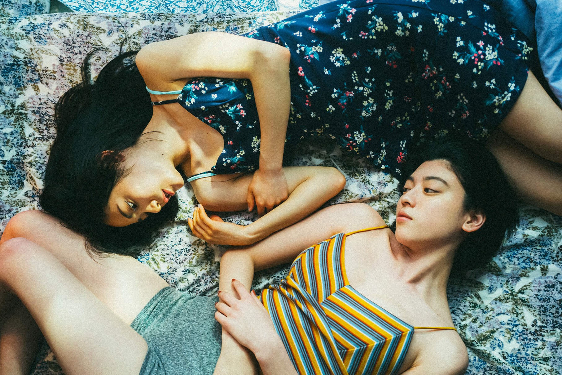 Two women lying on the floor
