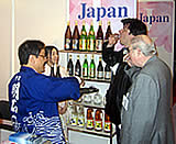 Visitors to the Japan booth sample Japanese food and drink