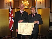 Geoffrey Hamilton MBE with his family and Ambassador & Madame Nogami